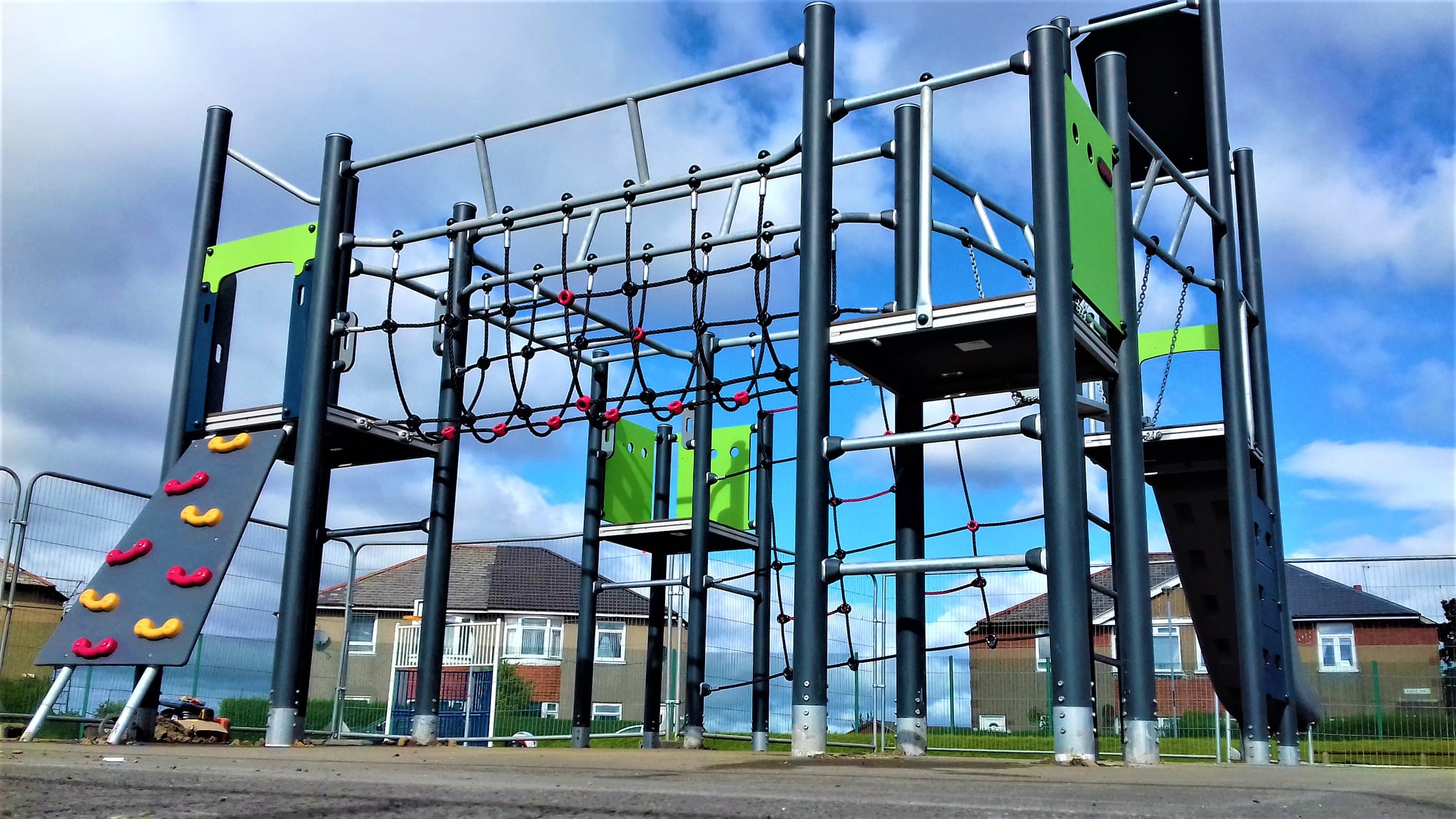 Inclusive playground equipment and safety surfacing